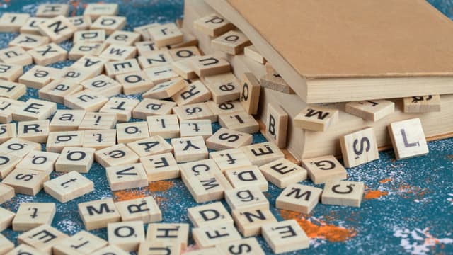 Book with Wooden Letters Spilling Out